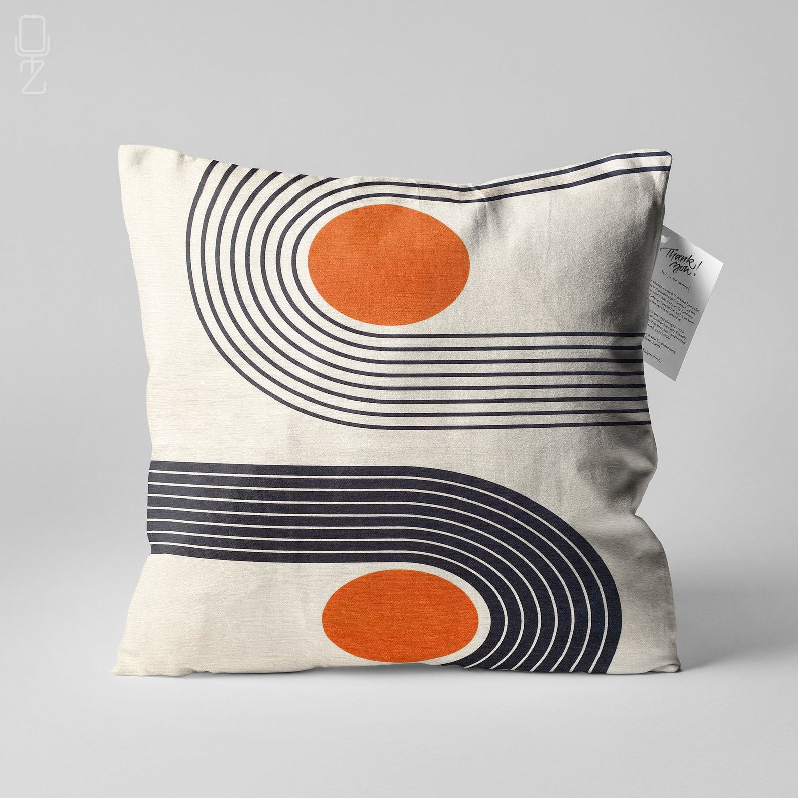 Abstract Ivory Cushion Cover Designs with Vibrant Orange Accents