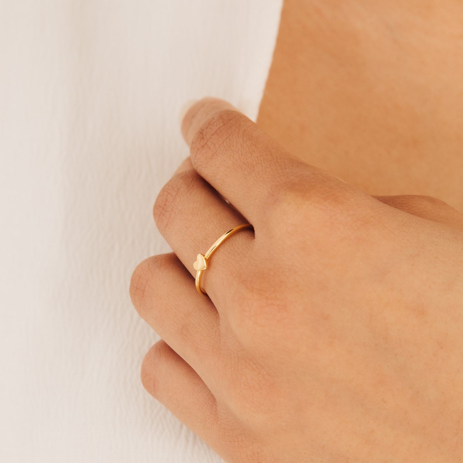 Caitlyn Minimalist’s Dainty Heart Charm Ring A Symbol of Love and Promise
