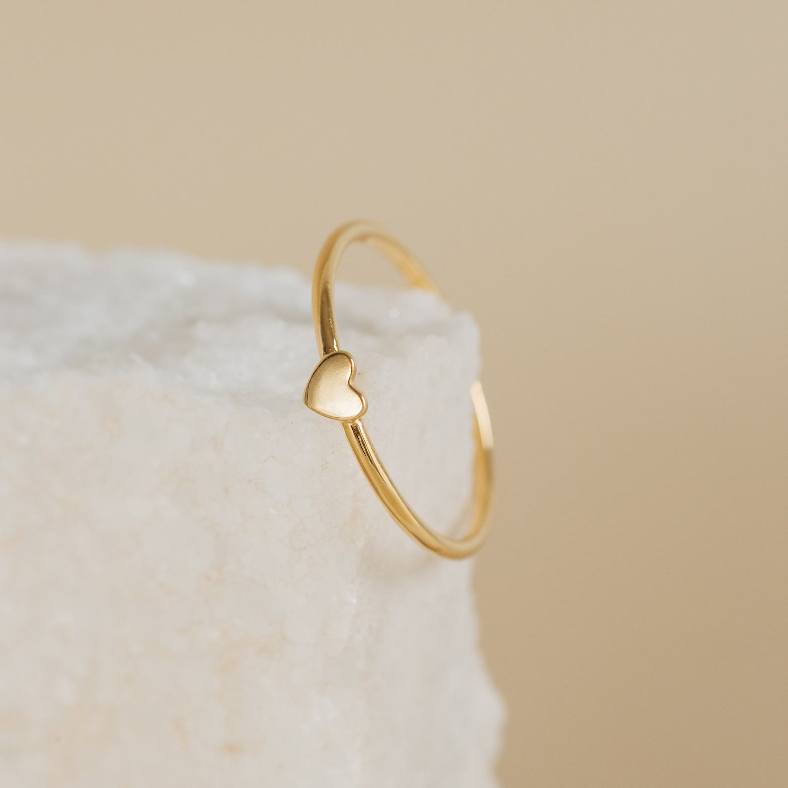 Caitlyn Minimalist’s Dainty Heart Charm Ring A Symbol of Love and Promise