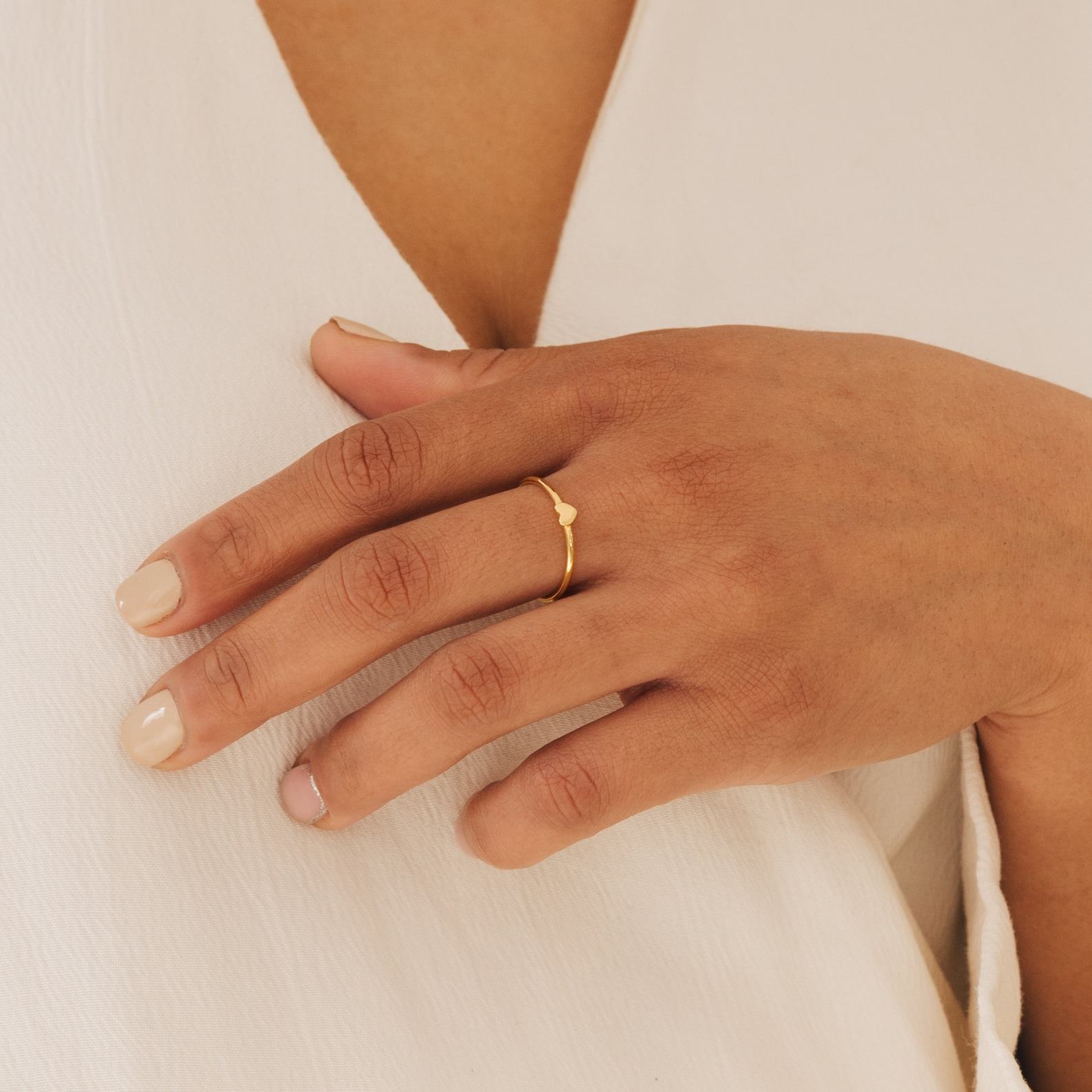 Caitlyn Minimalist’s Dainty Heart Charm Ring A Symbol of Love and Promise
