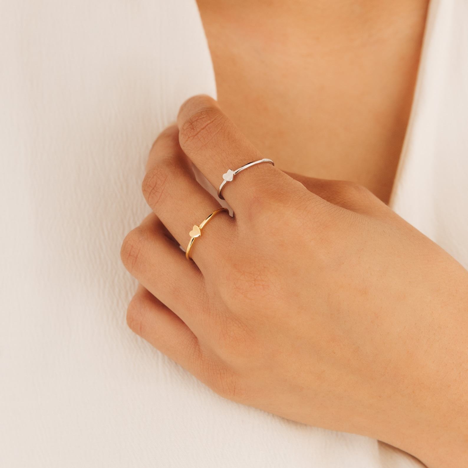 Caitlyn Minimalist’s Dainty Heart Charm Ring A Symbol of Love and Promise