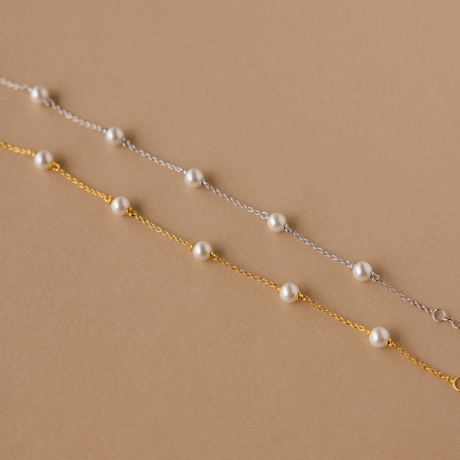 Caitlyn Minimalist’s Pearl Station Bracelet A Delicate Charm of Pearls and Gold