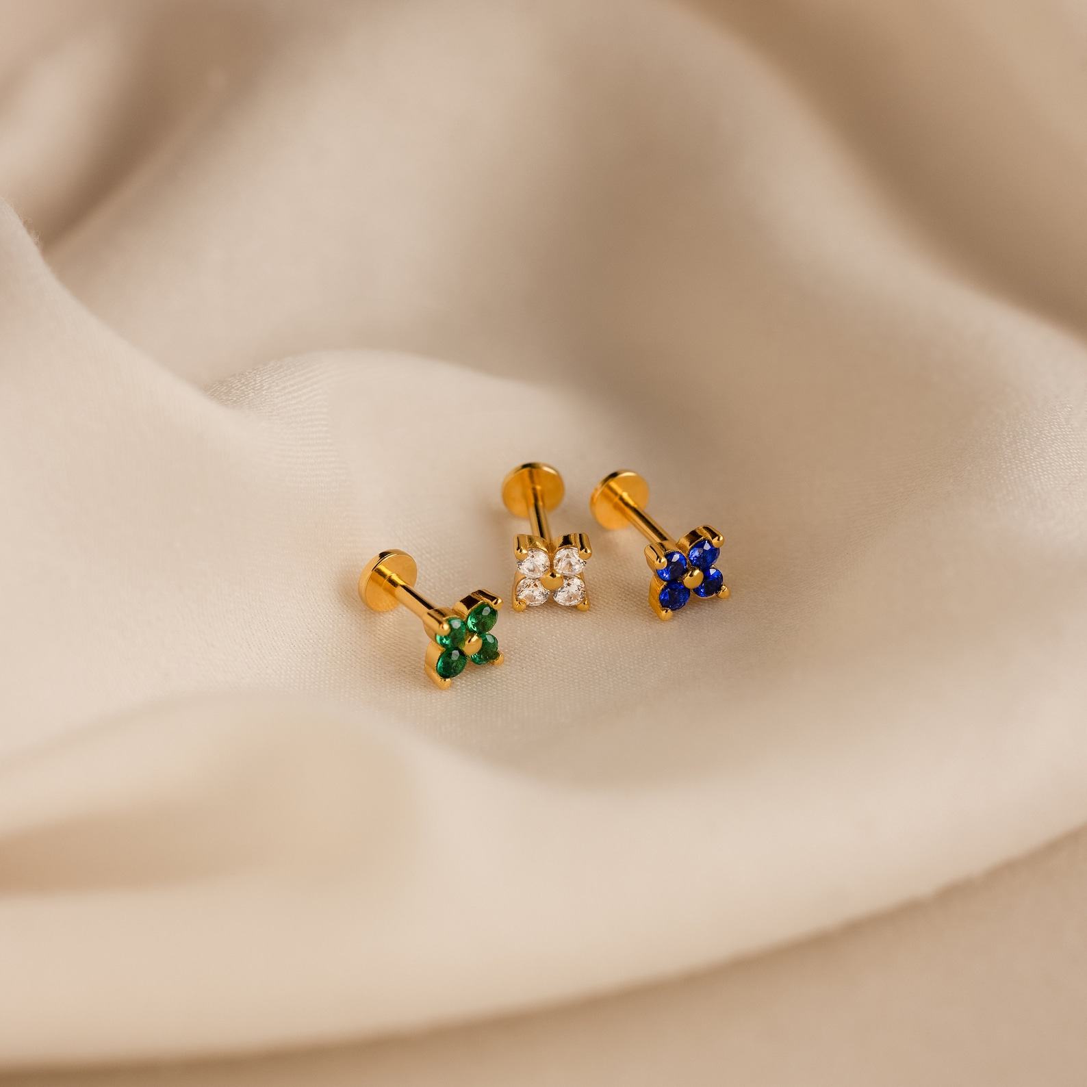 Caitlyn Minimalist’s Trio of Floral Studs Sapphire, Diamond, and Gold