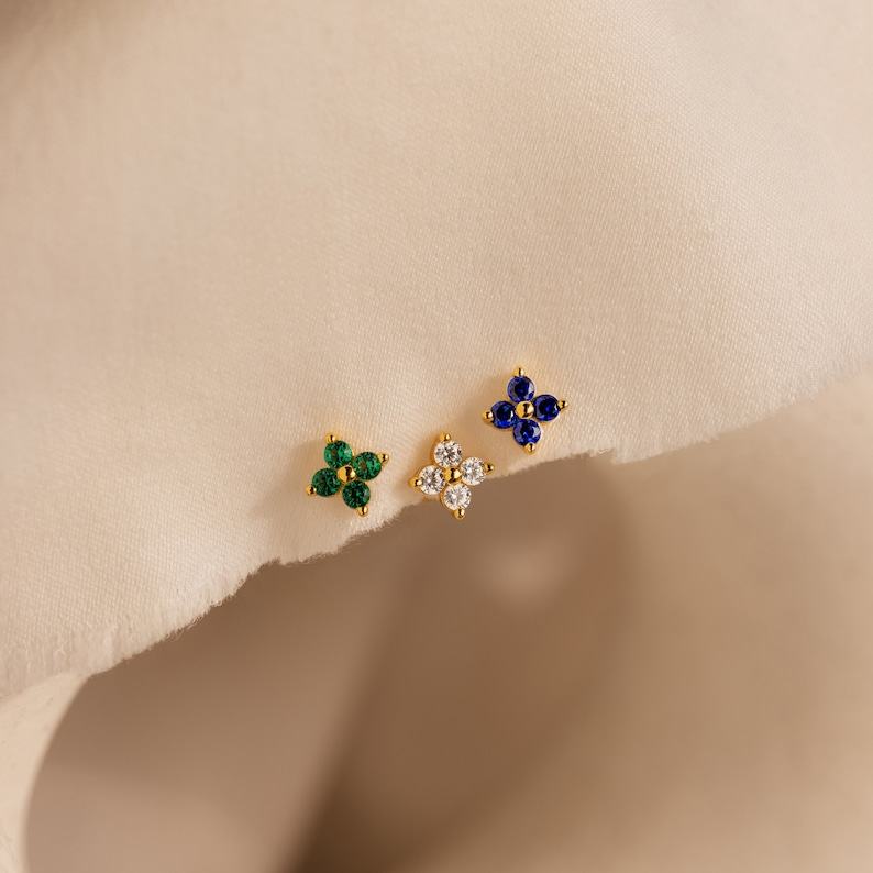 Caitlyn Minimalist’s Trio of Floral Studs Sapphire, Diamond, and Gold
