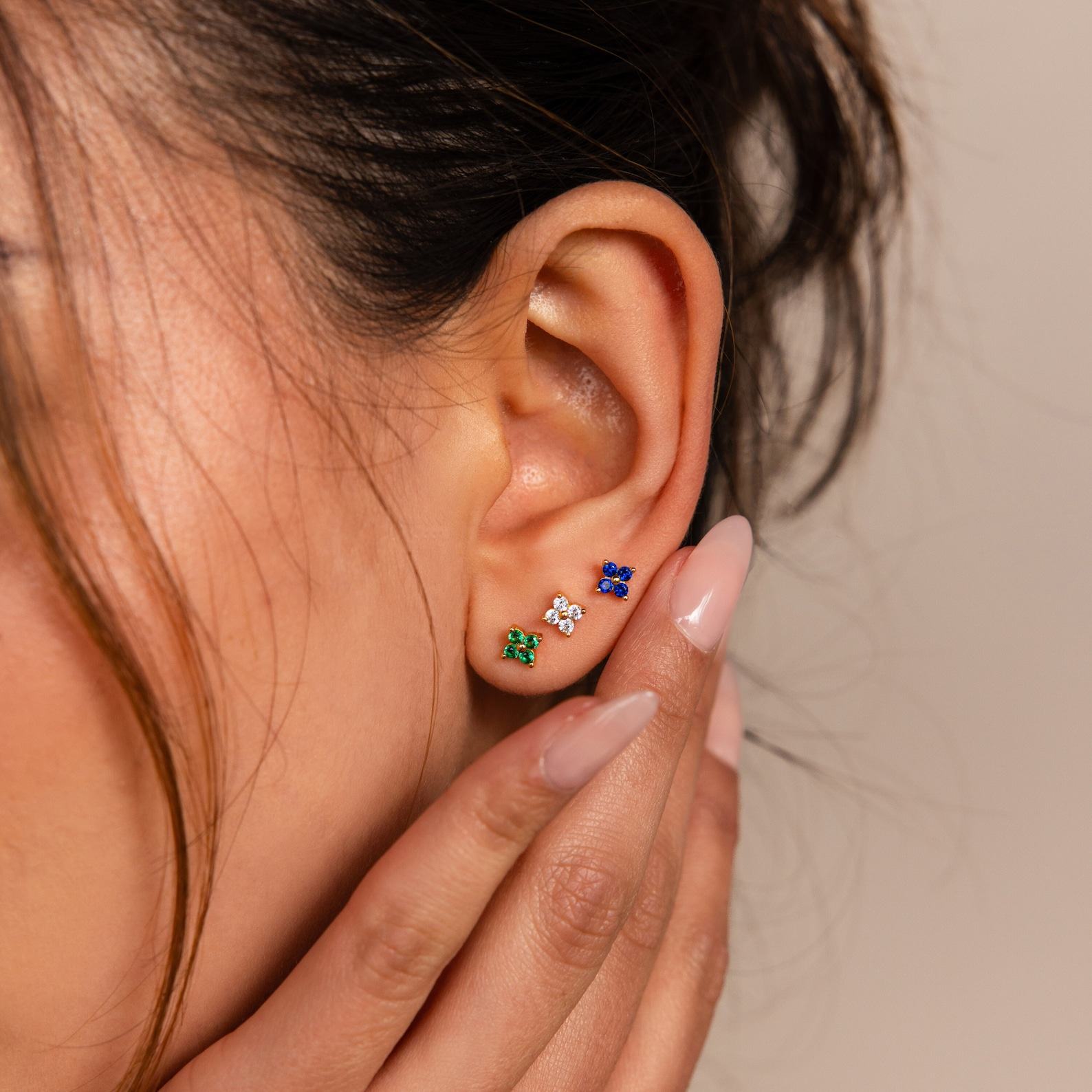 Caitlyn Minimalist’s Trio of Floral Studs Sapphire, Diamond, and Gold