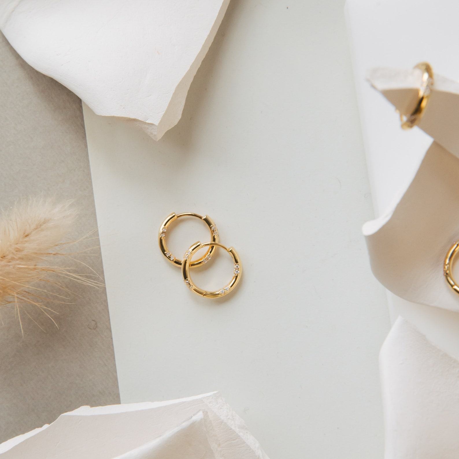 Celestial Embrace Caitlyn’s Eternity Pave Huggie Earrings, a Diamond-Studded Symphony