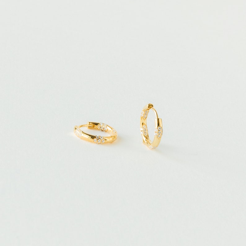 Celestial Embrace Caitlyn’s Eternity Pave Huggie Earrings, a Diamond-Studded Symphony