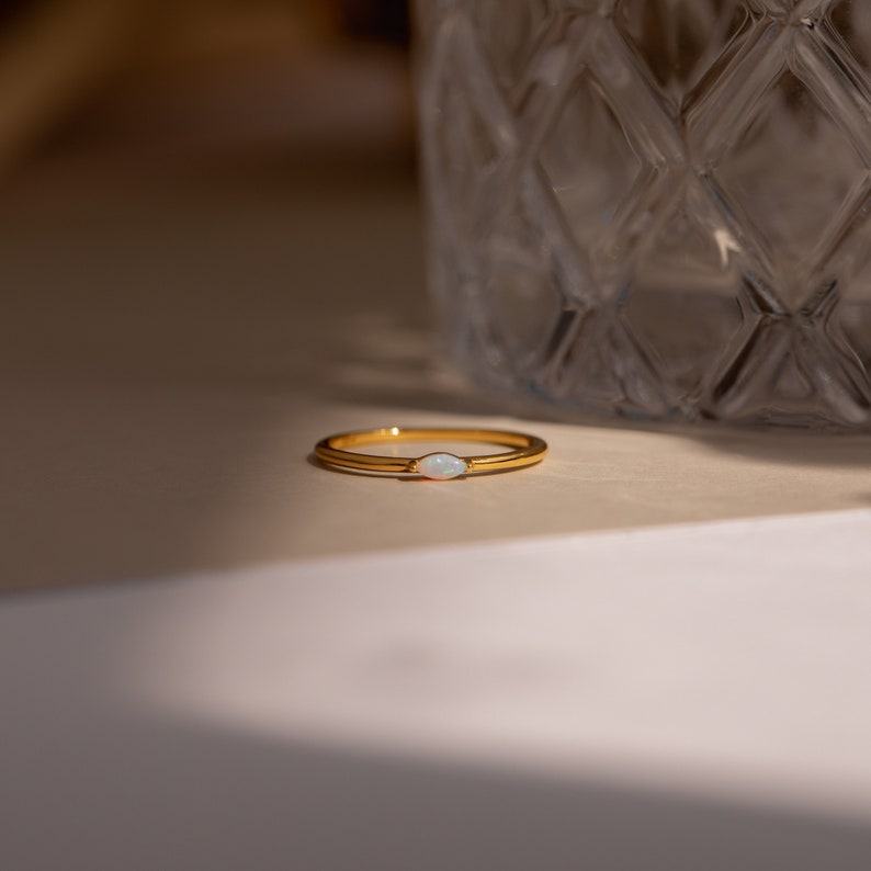 Celestial Radiance Caitlyn’s Delicate Opal Birthstone Ring for Timeless Elegance