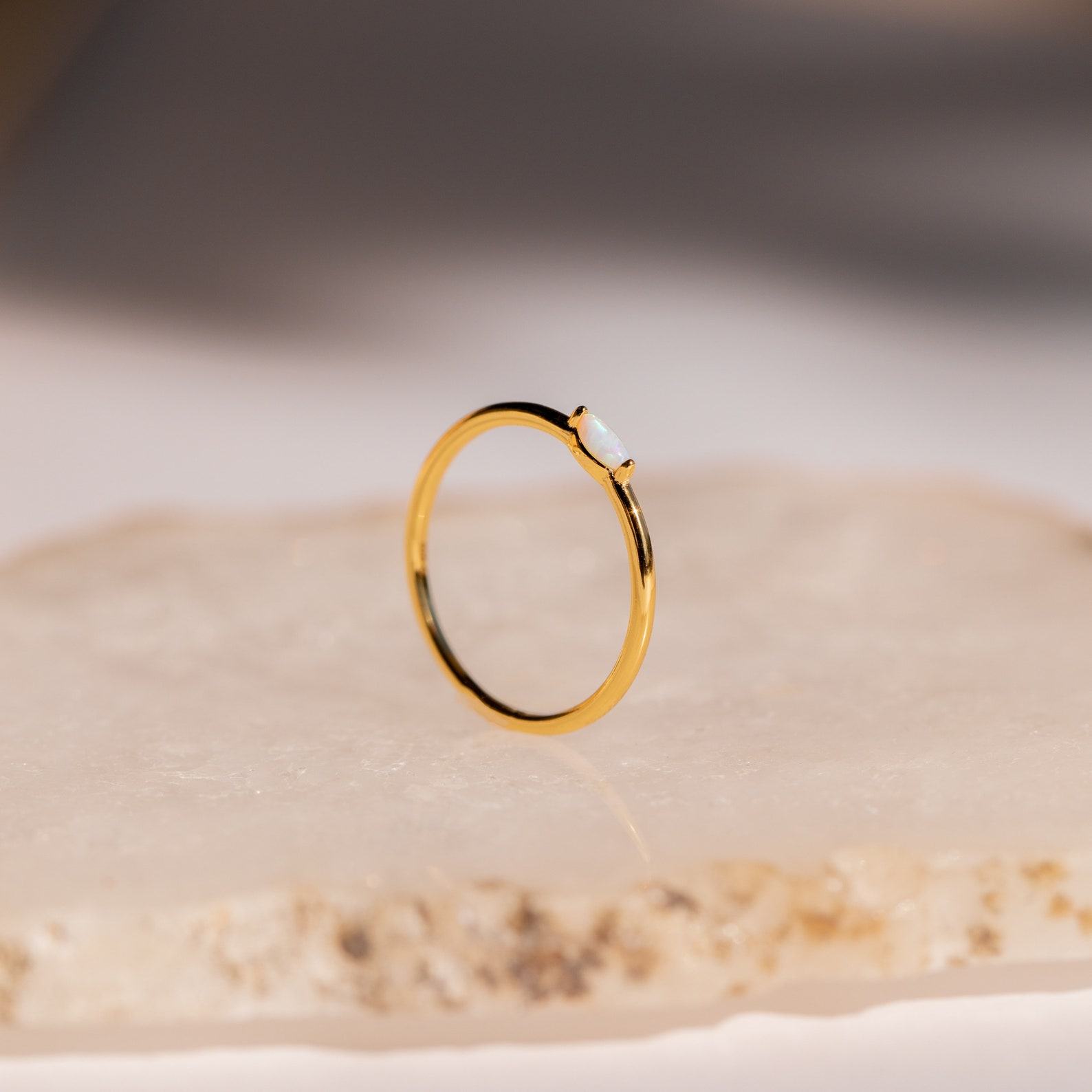 Celestial Radiance Caitlyn’s Delicate Opal Birthstone Ring for Timeless Elegance