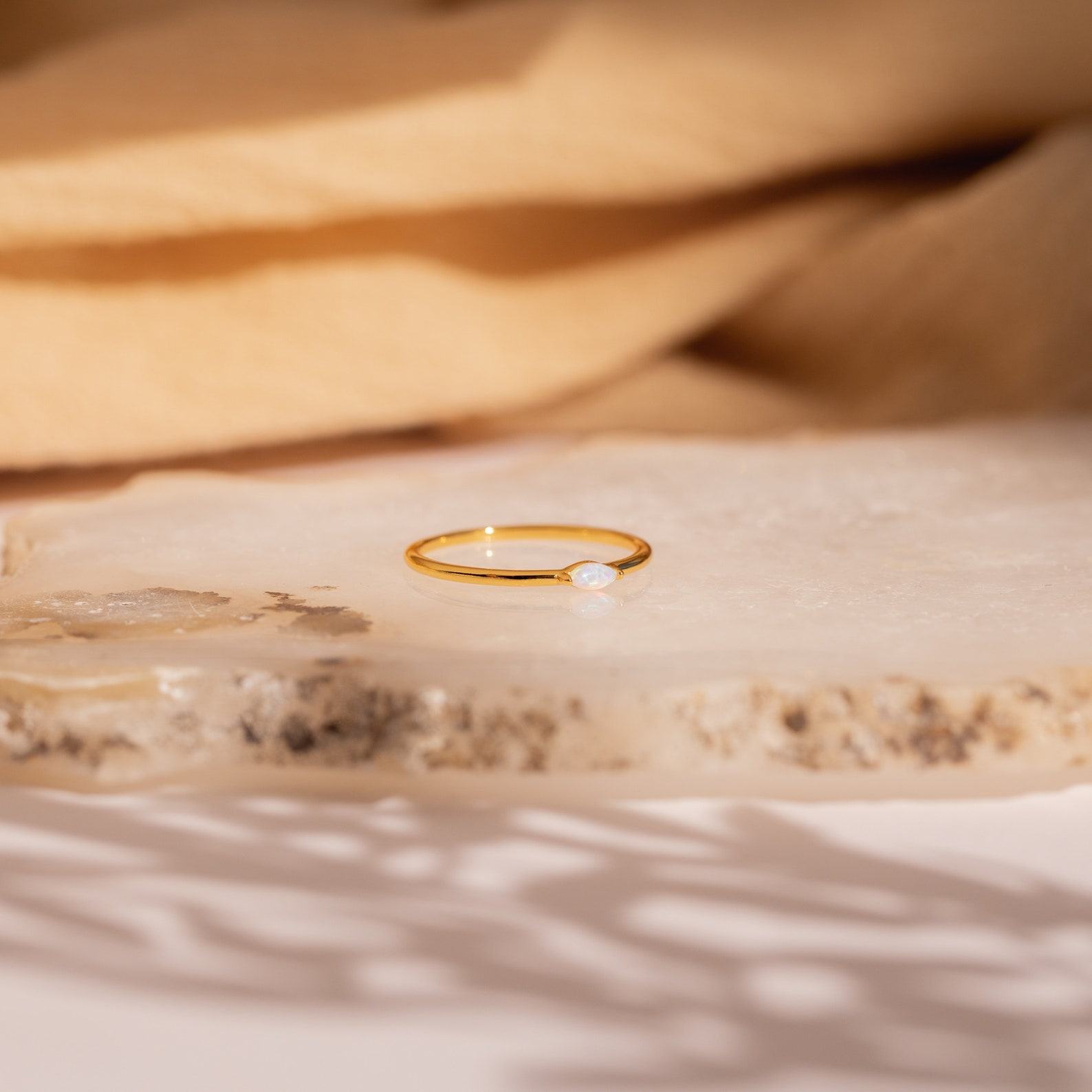 Celestial Radiance Caitlyn’s Delicate Opal Birthstone Ring for Timeless Elegance