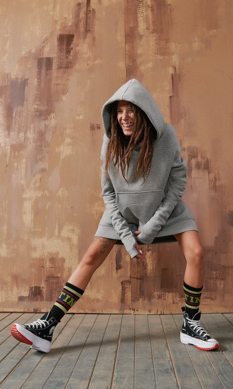 Cozy and Chic Elevate Your Style with Our Long Hoodie with Dropped Shoulder