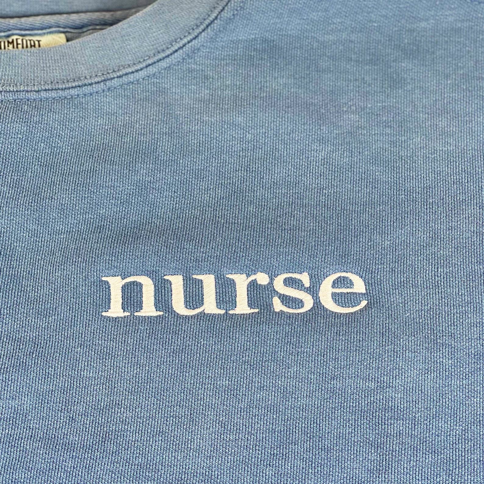 Cozy Comfort for Healthcare Heroes Embroidered Nurse Sweatshirt, Perfect for Graduation and Beyond