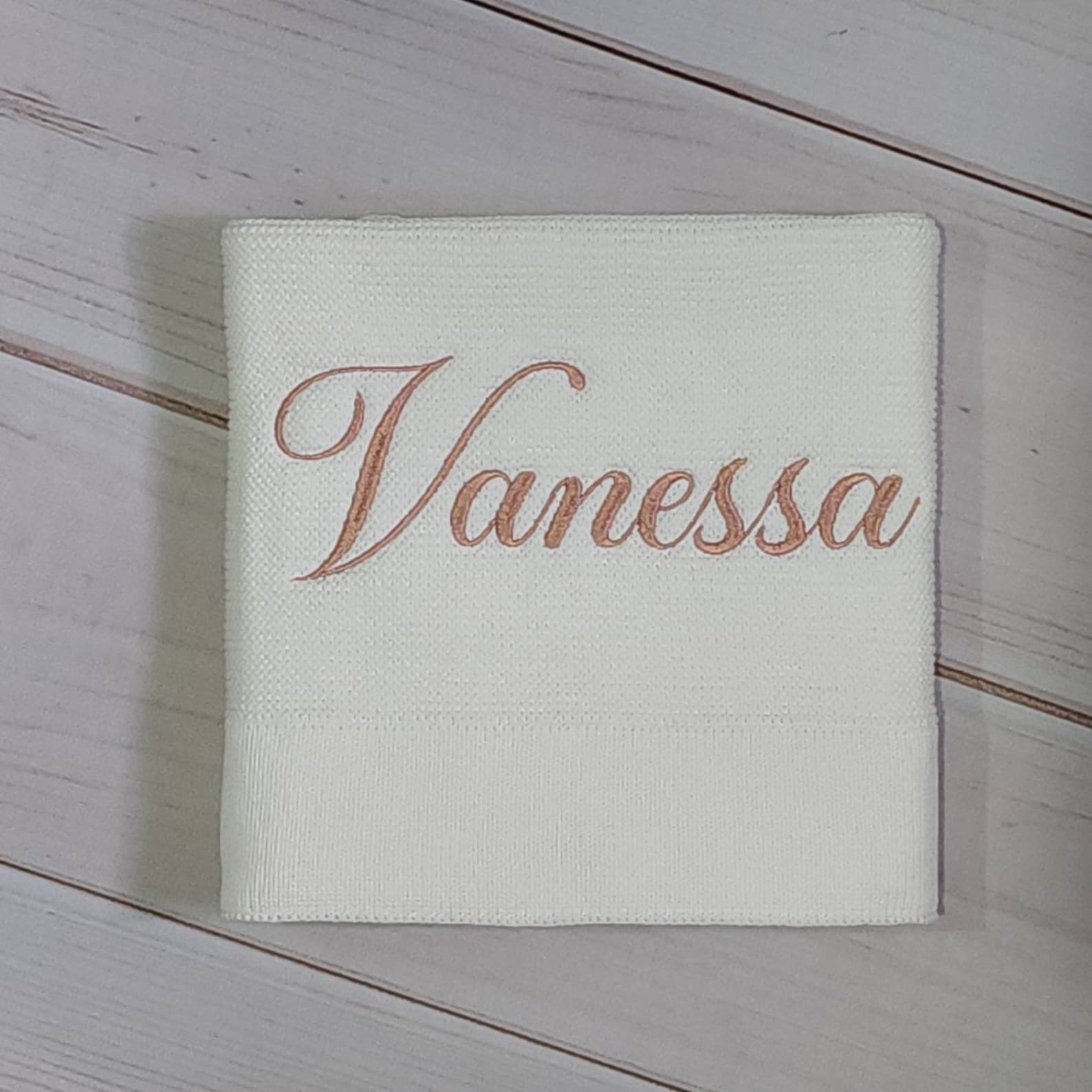 Cozy Comfort for Little Ones Off-White Knitted Baby Blanket with Embroidered Charm