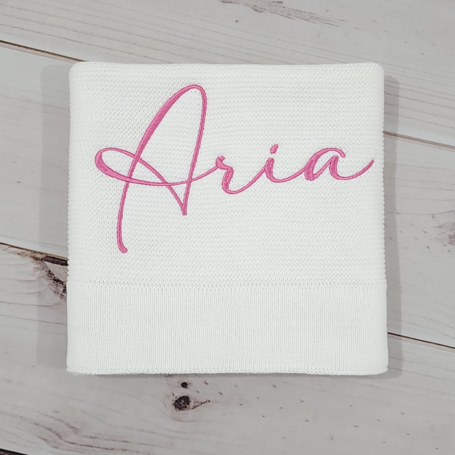 Cozy Comfort for Little Ones Off-White Knitted Baby Blanket with Embroidered Charm