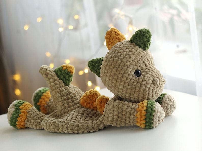 Cuddle Up with Prehistoric Charm Crochet Dinosaur Comforter and Lovey Pattern
