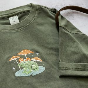 Embroidered Nature’s Embrace Personalized Frog and Mushroom T-shirt for Nature Enthusiasts