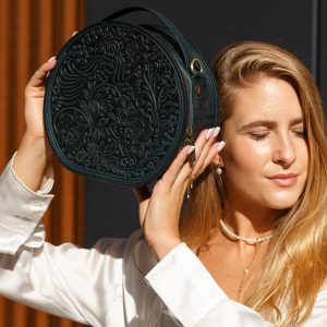 Exquisite Handmade Round Leather Bag with Intricate Flower Embossing
