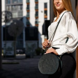 Exquisite Handmade Round Leather Bag with Intricate Flower Embossing