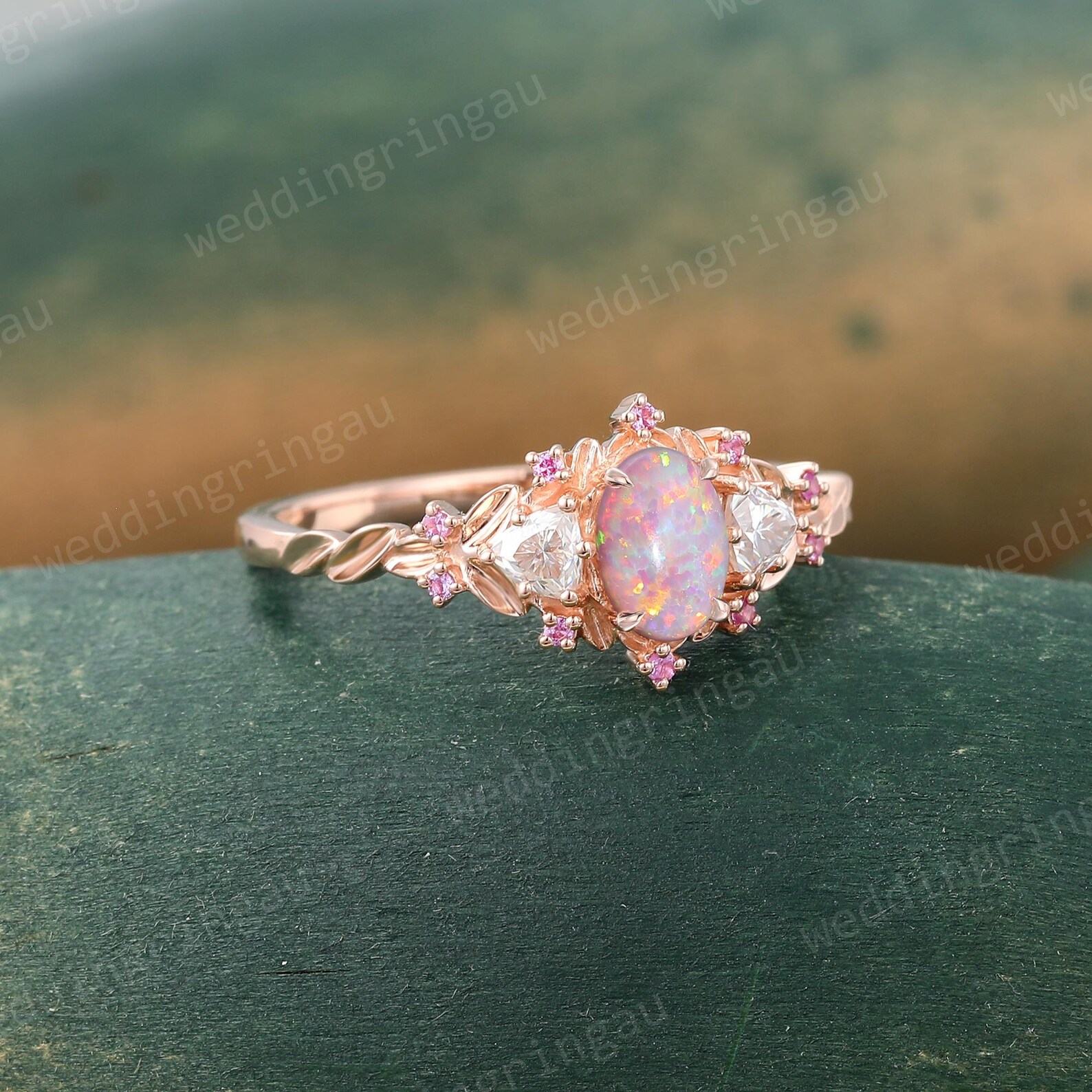 Exquisite Oval Pink Opal Engagement Ring A Symphony of Rose Gold, Moissanite, and Pink Sapphire