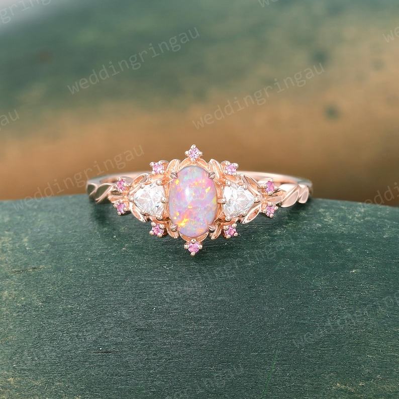 Exquisite Oval Pink Opal Engagement Ring A Symphony of Rose Gold, Moissanite, and Pink Sapphire