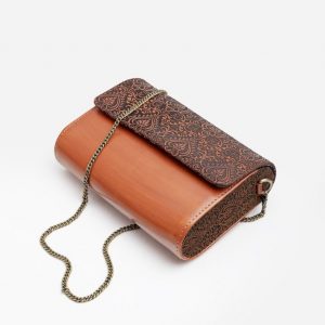 Exquisitely Crafted Orange Leather Sling Bag A Symphony of Teak Wood and Hand-Tooled Art
