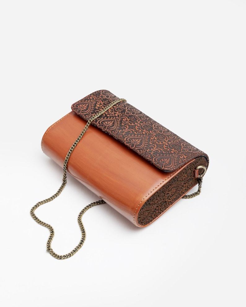 Exquisitely Crafted Orange Leather Sling Bag A Symphony of Teak Wood and Hand-Tooled Art
