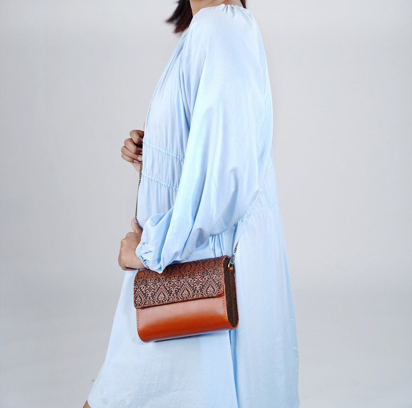 Exquisitely Crafted Orange Leather Sling Bag A Symphony of Teak Wood and Hand-Tooled Art - Image 4