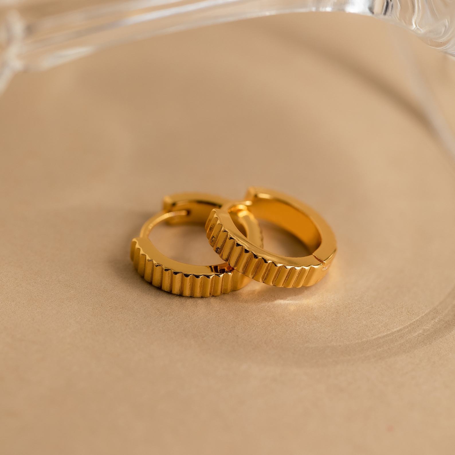 Golden Embrace Ribbed Huggie Hoops for a Timeless Allure