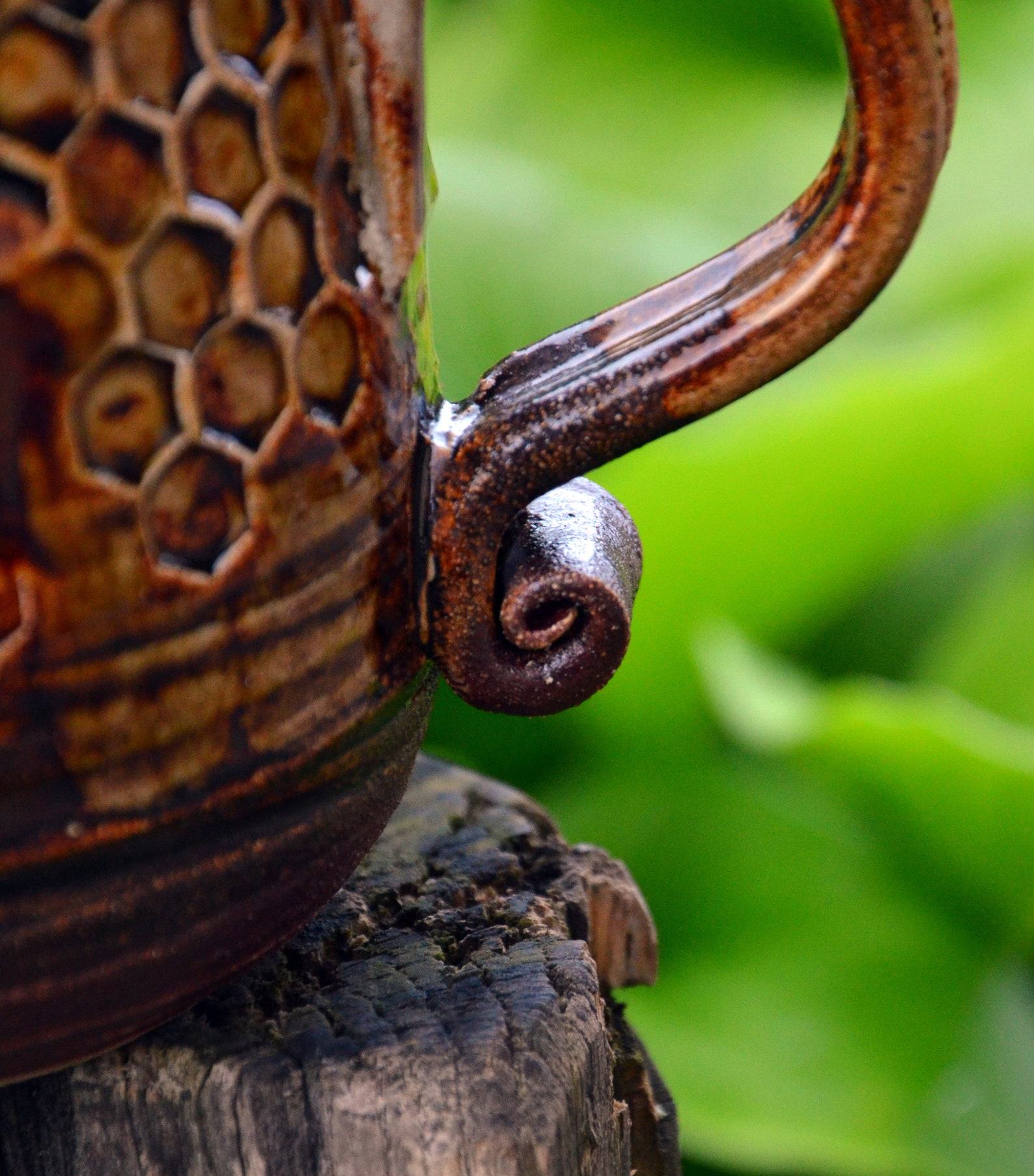 Honeycomb Haven Handmade Pottery Cup with Honey Glaze - Image 4