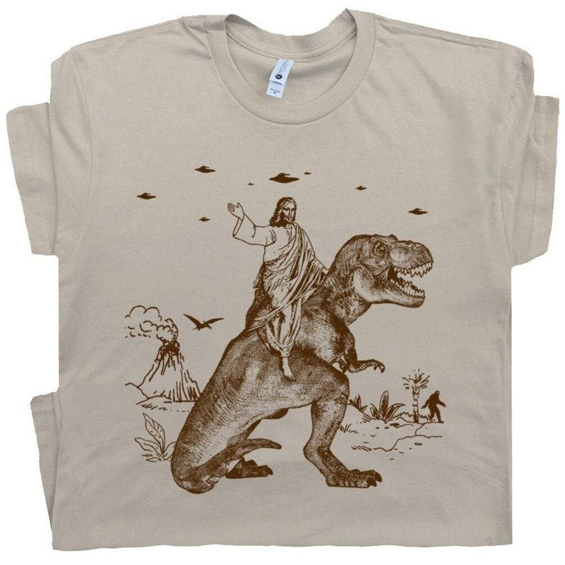 Jesus Riding Dinosaur T-Shirt The Ultimate Statement Piece for the Bold and Humorous