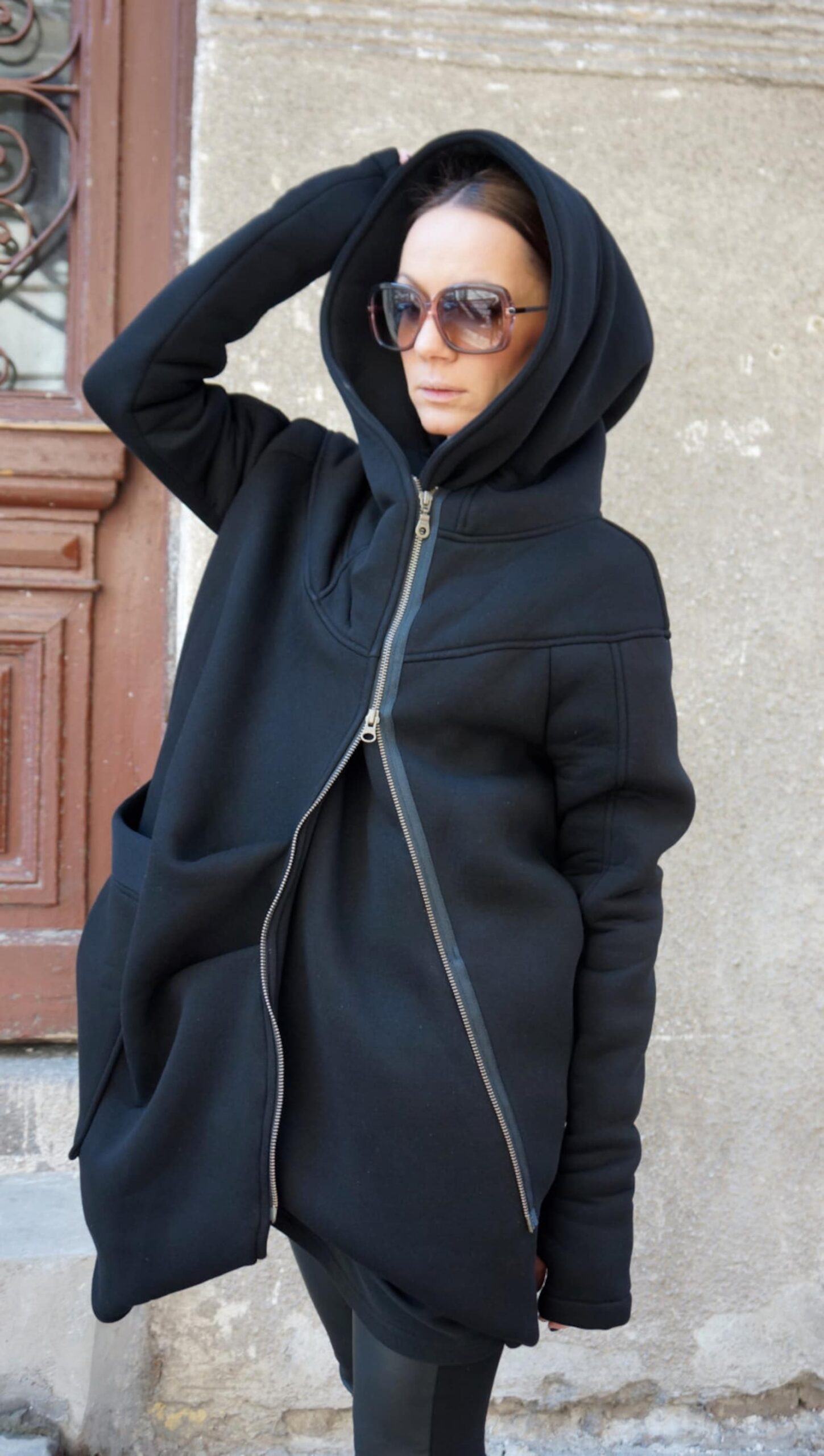 Luxurious Asymmetrical Black Hooded Coat Warmth, Style, and Functionality - Image 4