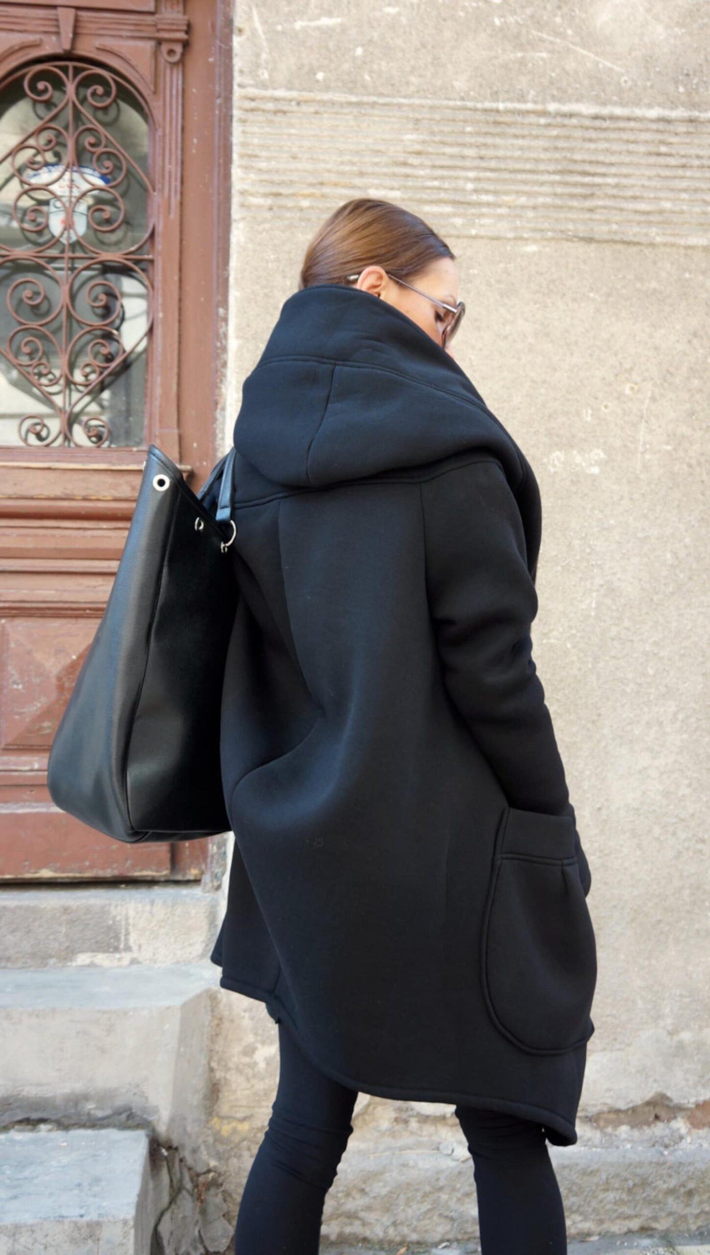 Luxurious Asymmetrical Black Hooded Coat Warmth, Style, and Functionality - Image 3