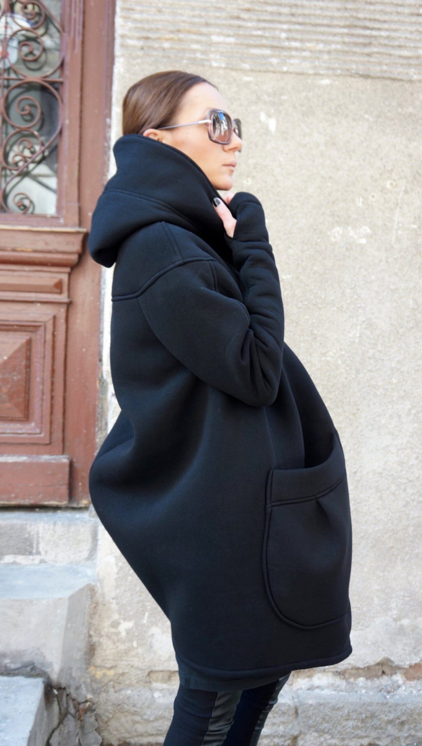 Luxurious Asymmetrical Black Hooded Coat Warmth, Style, and Functionality - Image 5