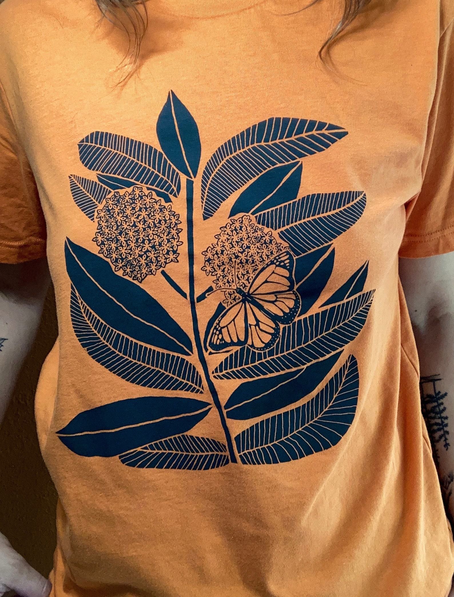 Monarch Butterfly and Milkweed A Symbiotic Symphony on a Handcrafted Tee - Image 3