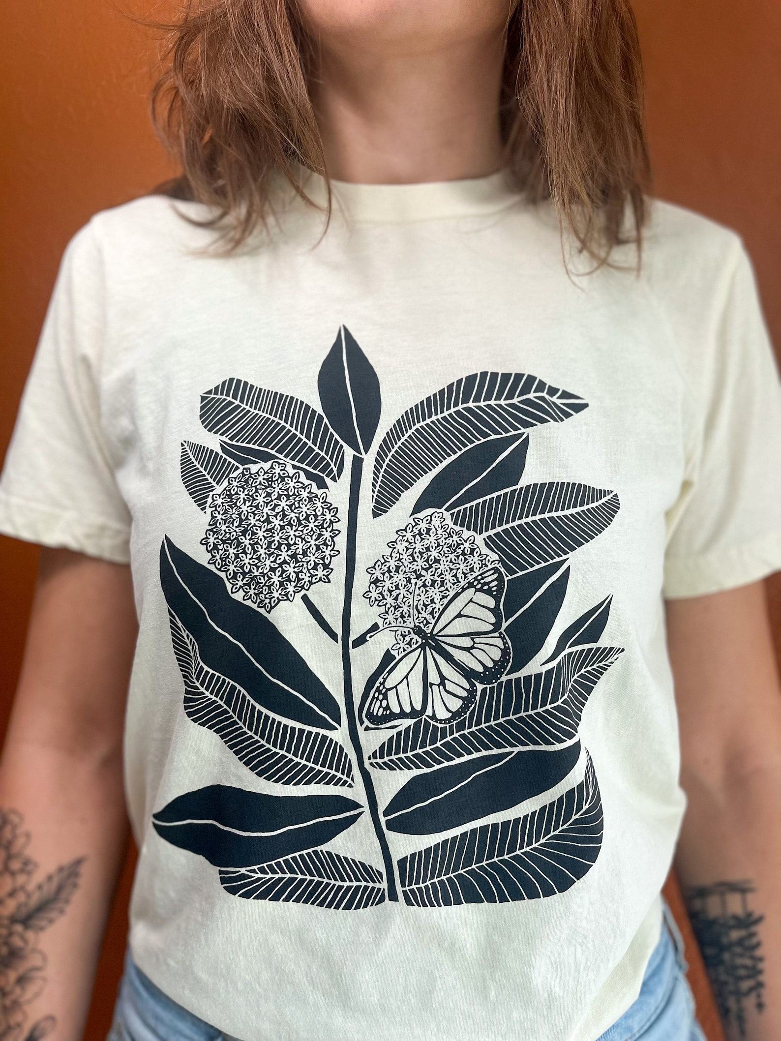Monarch Butterfly and Milkweed A Symbiotic Symphony on a Handcrafted Tee - Image 2