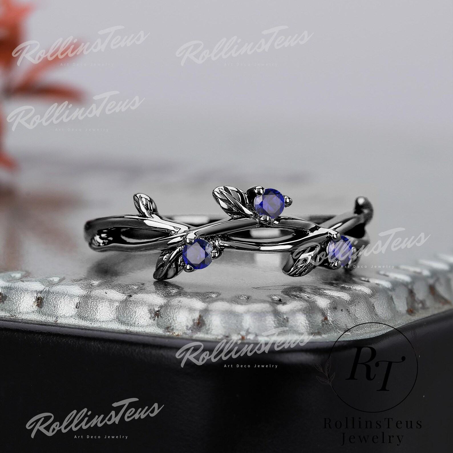Nature’s Embrace Blue Sapphire and Black Gold Twig Ring, a Symbol of Love and Growth