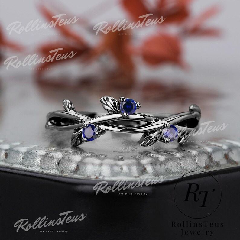 Nature’s Embrace Blue Sapphire and Black Gold Twig Ring, a Symbol of Love and Growth