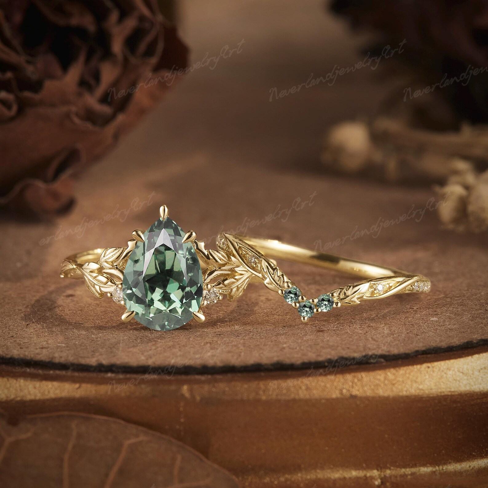 Nature’s Embrace Vintage Pear Cut Green Sapphire Engagement Ring Set with Leaf-Inspired Wedding Band