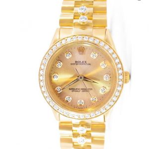 Rolex Oyster Perpetual 34mm Timeless Elegance with a Diamond-Studded Champagne Dial