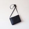 Sleek and Sophisticated The Minimalist Black Leather Crossbody Bag with Magnetic Closure