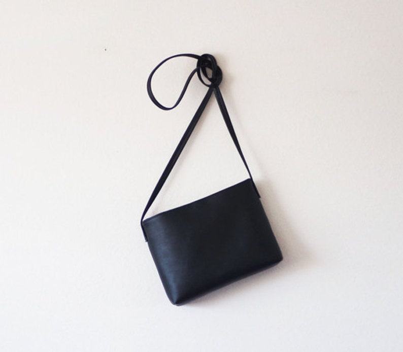 Sleek and Sophisticated The Minimalist Black Leather Crossbody Bag with Magnetic Closure