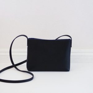 Sleek and Sophisticated The Minimalist Black Leather Crossbody Bag with Magnetic Closure