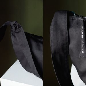 Spacious Black Hobo Bag with Green Lining and Adjustable Strap