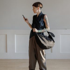 Spacious Black Hobo Bag with Green Lining and Adjustable Strap