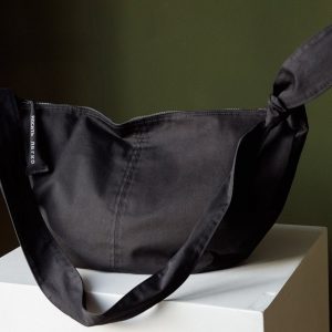 Spacious Black Hobo Bag with Green Lining and Adjustable Strap