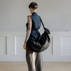 Spacious Black Hobo Bag with Green Lining and Adjustable Strap