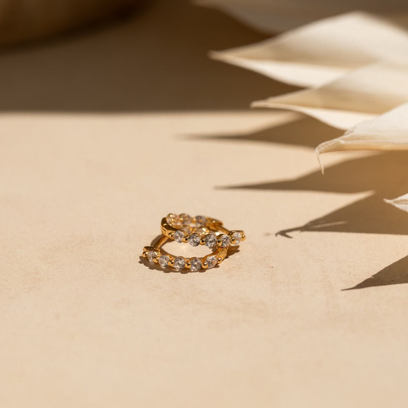 Sparkling Embrace Caitlyn Minimalist’s Inside Out Diamond Huggies