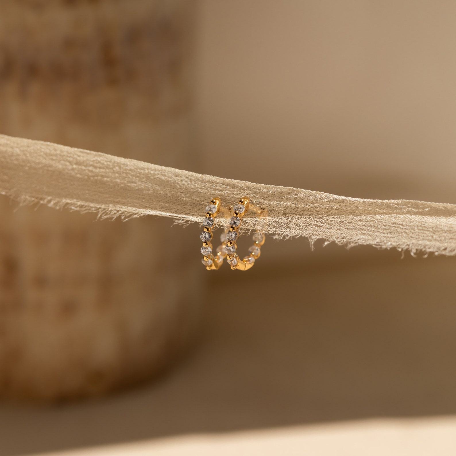 Sparkling Embrace Caitlyn Minimalist’s Inside Out Diamond Huggies