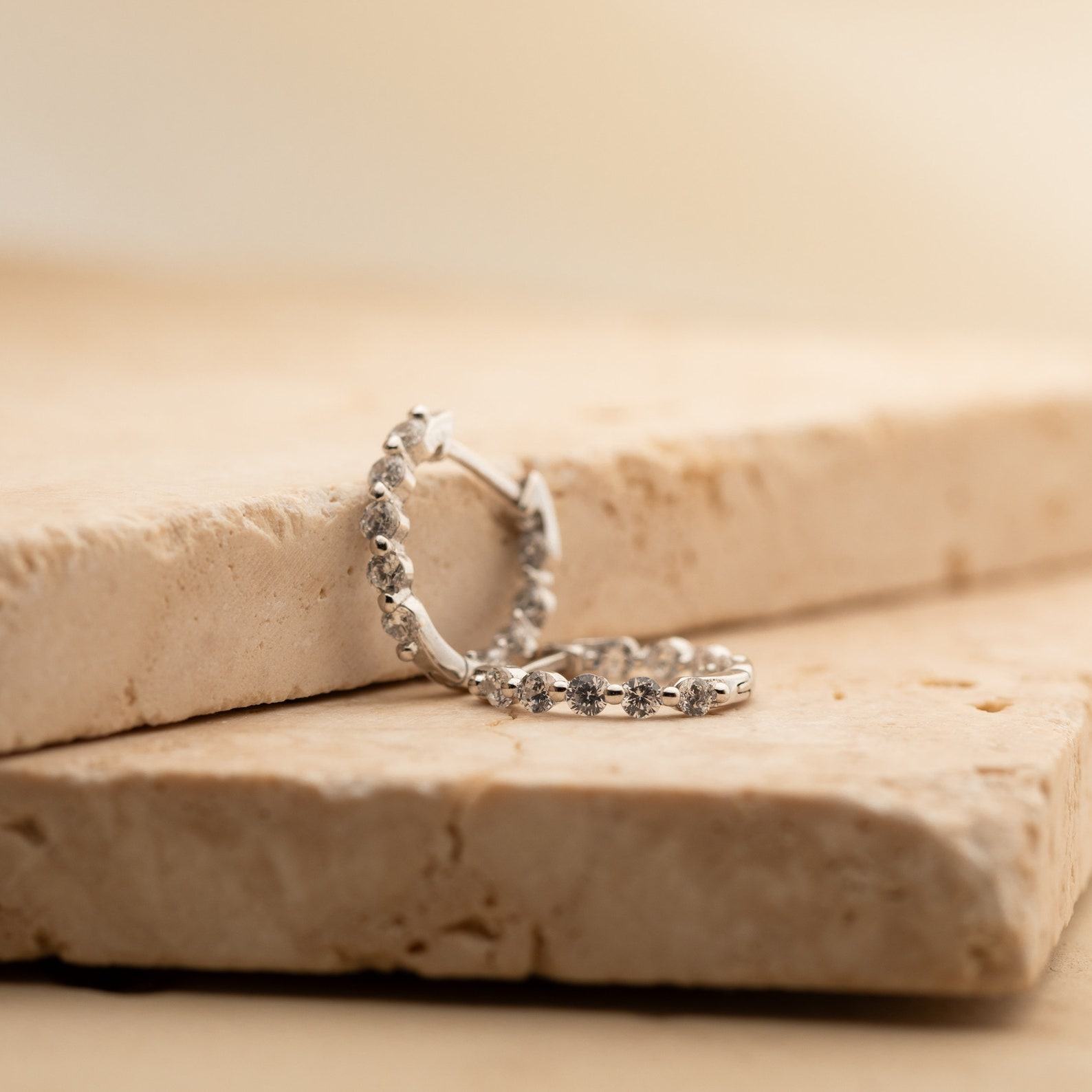 Sparkling Embrace Caitlyn Minimalist’s Inside Out Diamond Huggies