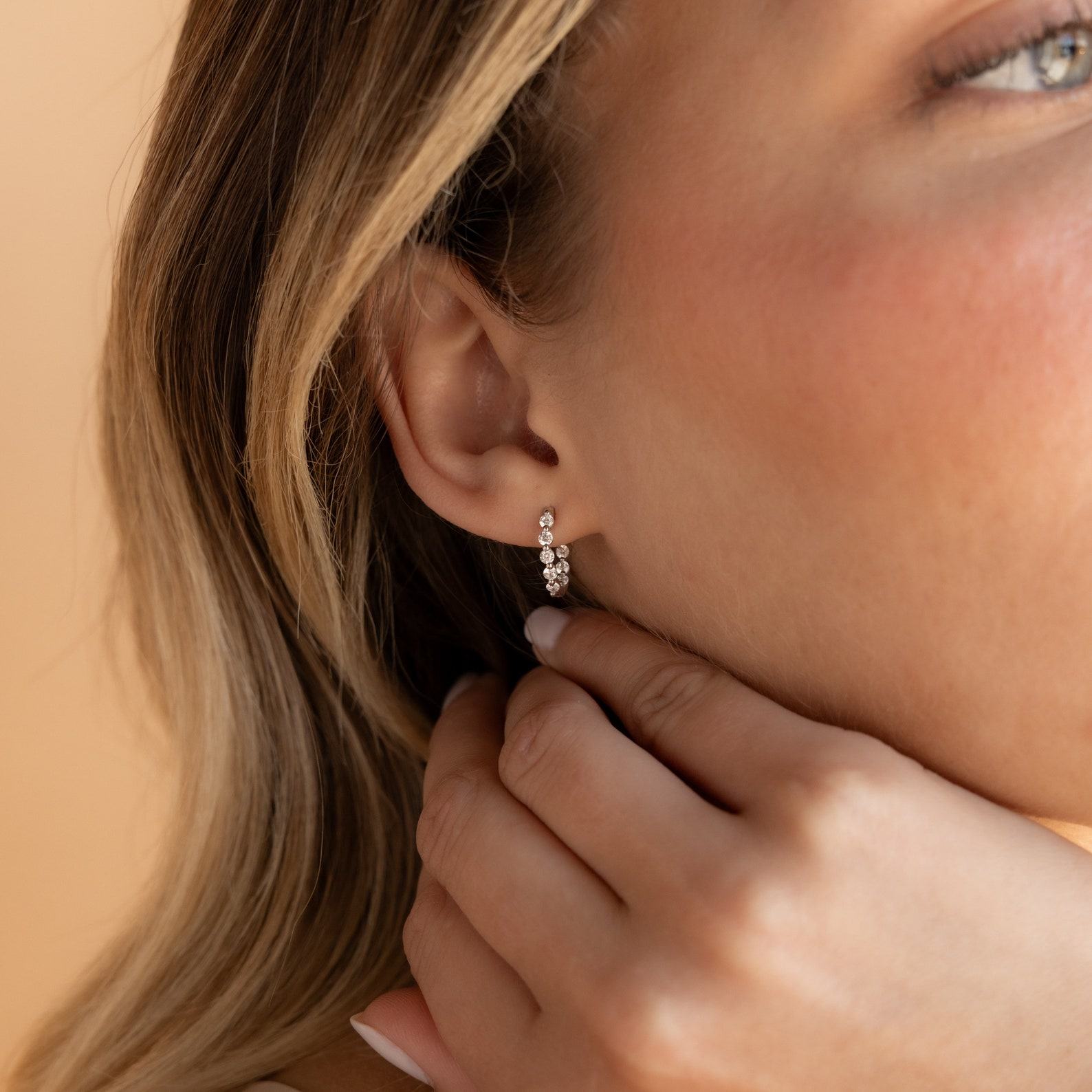 Sparkling Embrace Caitlyn Minimalist’s Inside Out Diamond Huggies